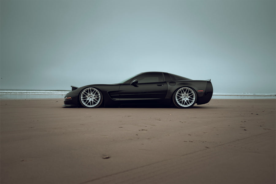 The Chevrolet Corvette stands tall as one of America's most iconic performance vehicles, a quintessential muscle car that has captivated generations of automotive enthusiasts. The C5 Corvette made its debut in 1996, eventually succeeded by the C6 Corvette in 2005. Renowned for its robust 5.7L LS1 engine, delivering 345 horsepower and 350 lb-ft of torque, the C5 was also notable for being the final model to feature the iconic popup headlights. This 2001 Chevrolet Corvette has undergone significan