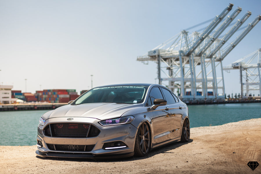 A 2013 Ford Fusion on Blaque Diamond BD-11 Gloss Black Wheels