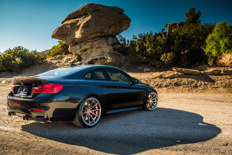 A 2015 BMW M4 on Staggered Blaque Diamond BD-23 Matte Bronze Wheels