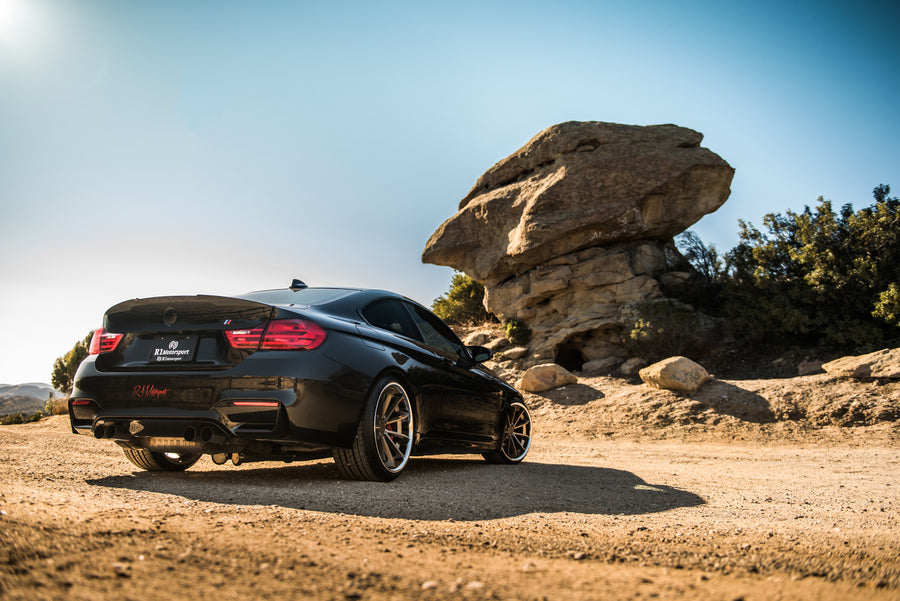 A 2015 BMW M4 on Staggered Blaque Diamond BD-23 Matte Bronze Wheels