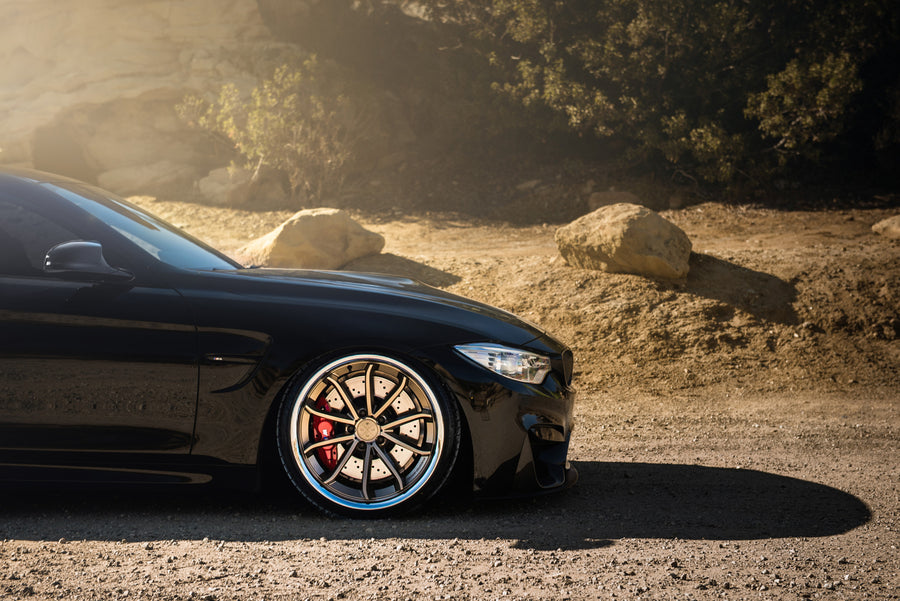 A 2015 BMW M4 on Staggered Blaque Diamond BD-23 Matte Bronze Wheels