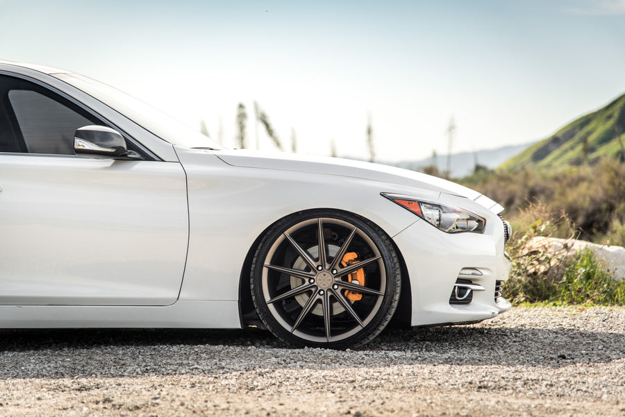 A 2015 Infiniti Q50 on 20 Inch Blaque Diamond BD-11 Matte Antique Bronze Wheels