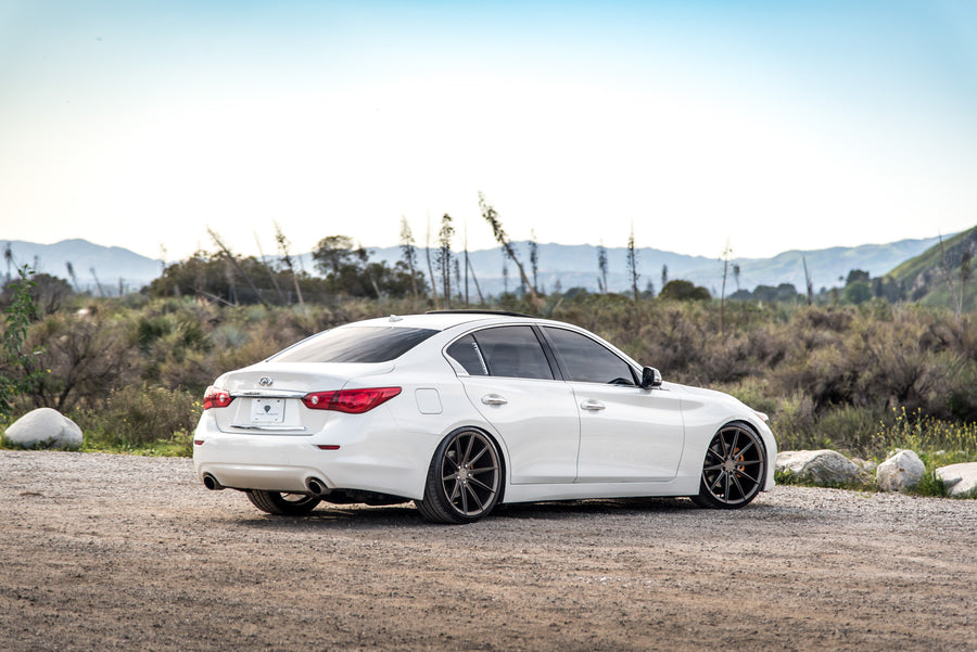 A 2015 Infiniti Q50 on 20 Inch Blaque Diamond BD-11 Matte Antique Bronze Wheels