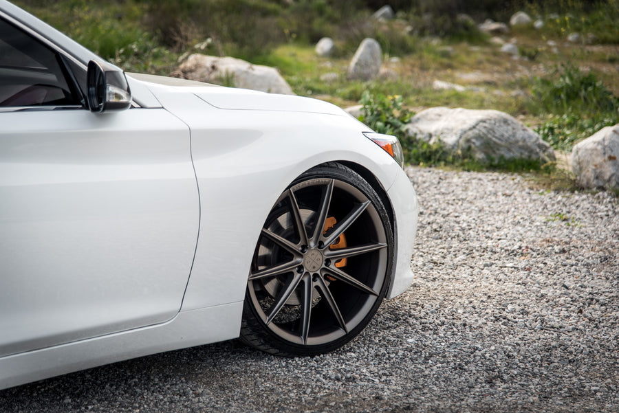 A 2015 Infiniti Q50 on 20 Inch Blaque Diamond BD-11 Matte Antique Bronze Wheels