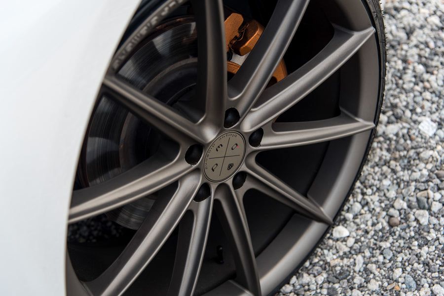 A 2015 Infiniti Q50 on 20 Inch Blaque Diamond BD-11 Matte Antique Bronze Wheels