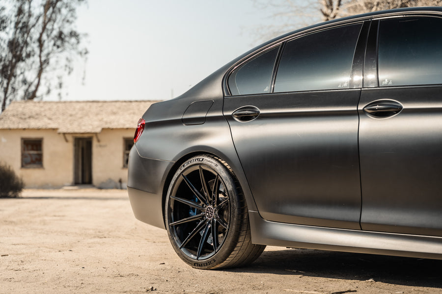 A 2016 BMW M5 on 20 Inch Blaque Diamond BD-11 Gloss Black Wheels
