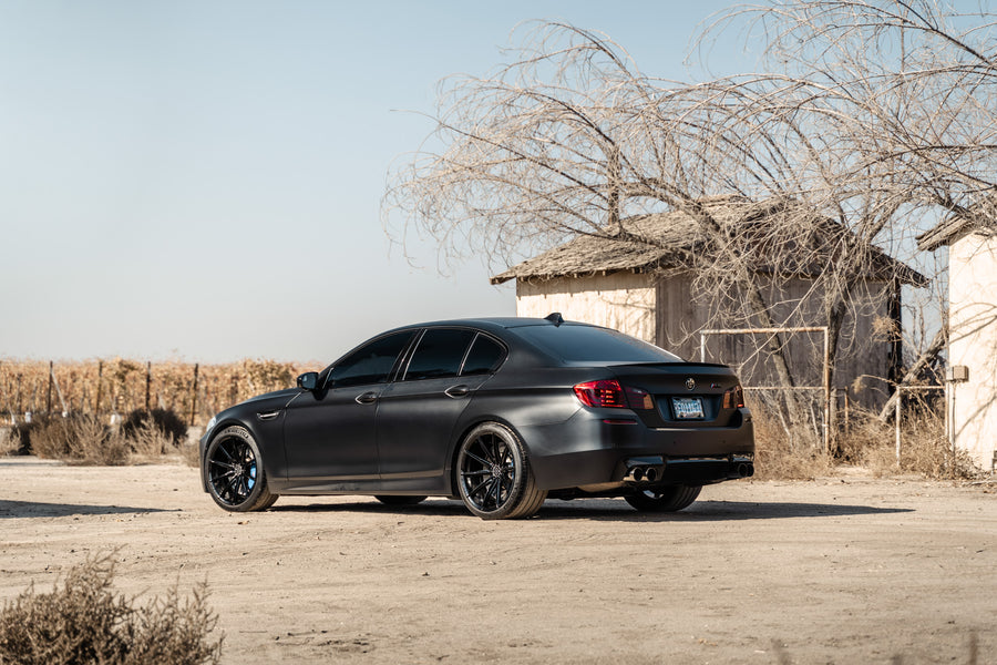 A 2016 BMW M5 on 20 Inch Blaque Diamond BD-11 Gloss Black Wheels