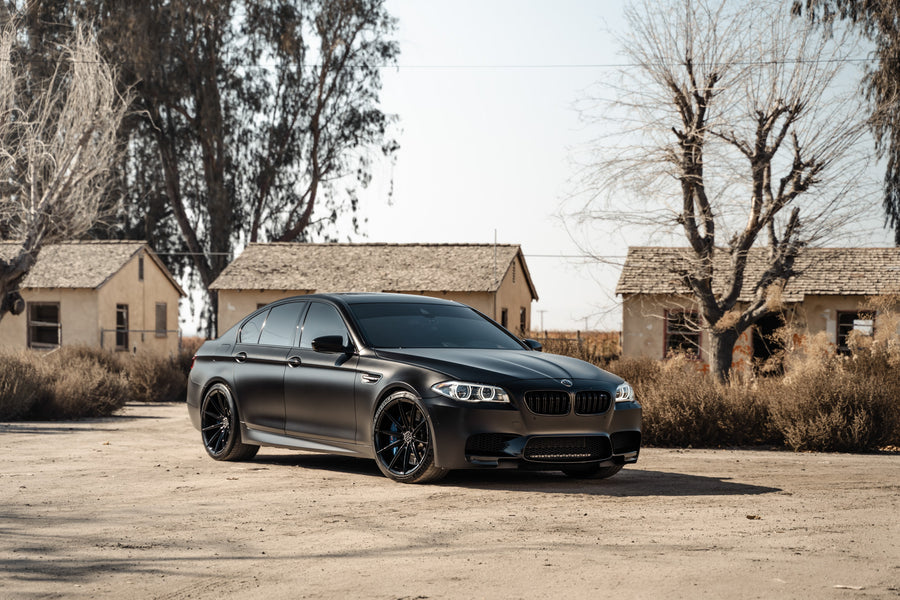 A 2016 BMW M5 on 20 Inch Blaque Diamond BD-11 Gloss Black Wheels