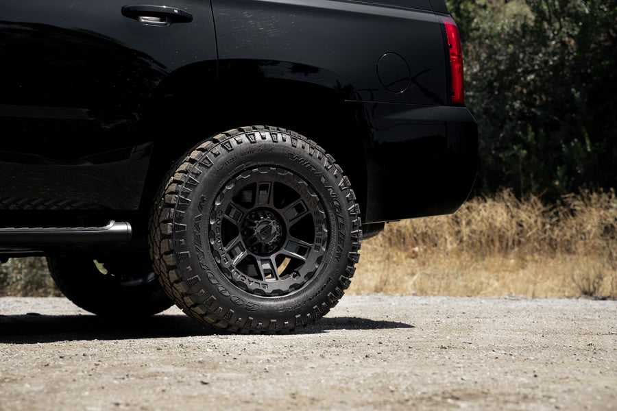 A 2017 Chevrolet Tahoe on 18 Inch Blaque Diamond BD-0801 Textured Black Wheels