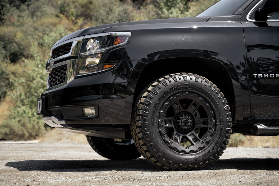 A 2017 Chevrolet Tahoe on 18 Inch Blaque Diamond BD-0801 Textured Black Wheels