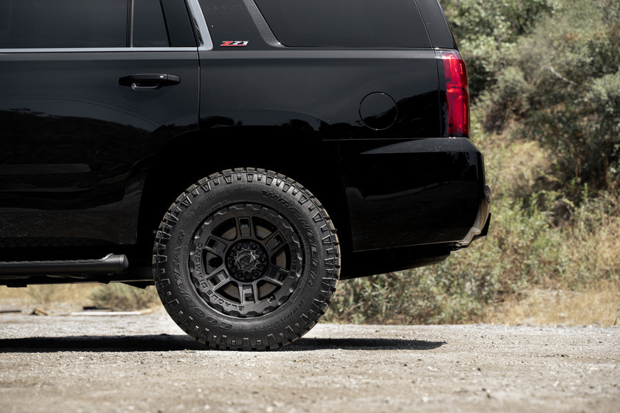 A 2017 Chevrolet Tahoe on 18 Inch Blaque Diamond BD-0801 Textured Black Wheels