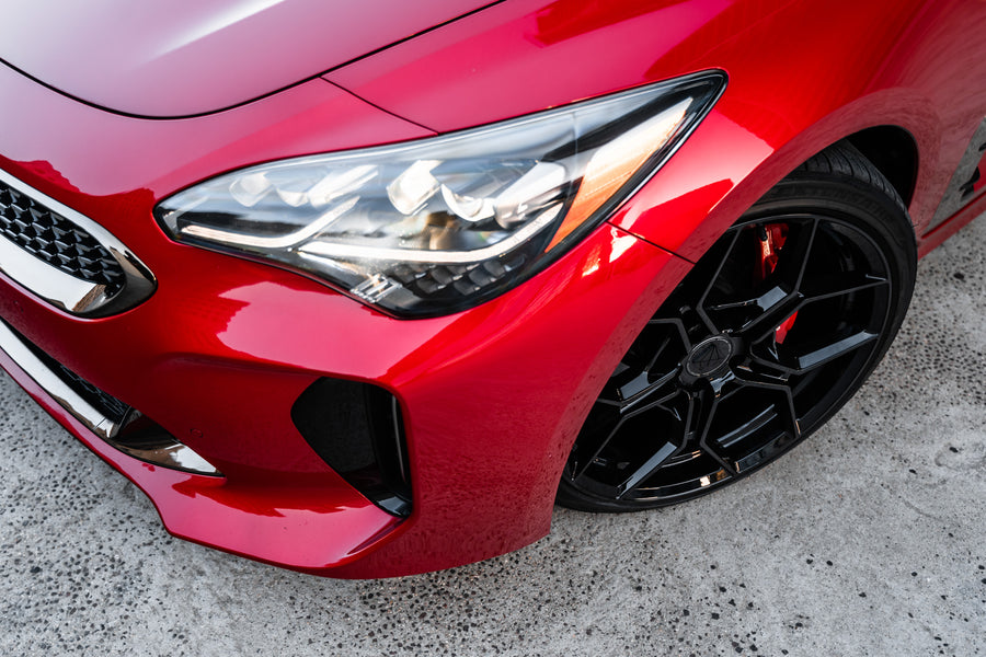 A 2019 Kia Stinger GT on 20 Inch Blaque Diamond BD-F25 Gloss Black Wheels