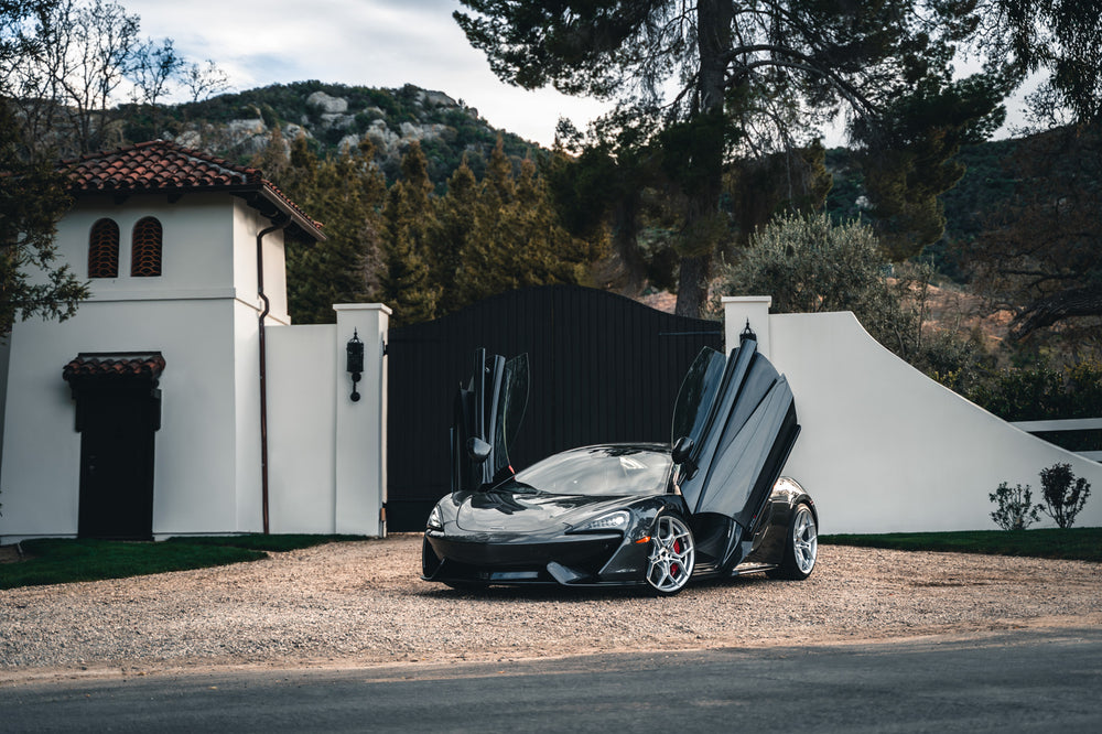 A 2019 McLaren 570s on 20 Inch Blaque Diamond BD-F25 Brushed Silver Wheels