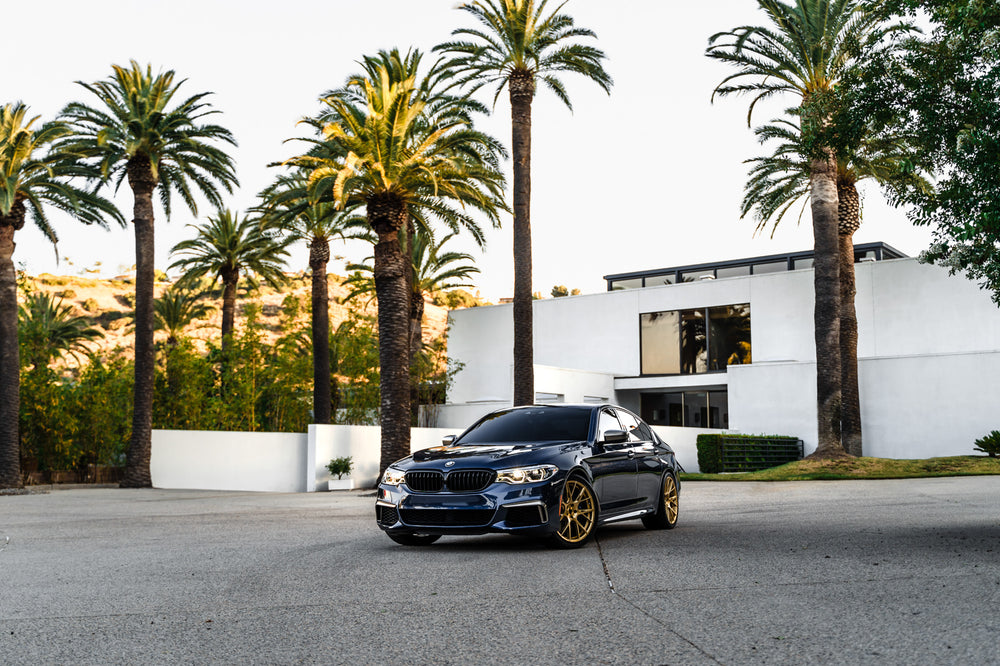 A 2020 BMW M550 on 20 Inch Blaque Diamond BD-F18 Custom Finish Transparent Brass Wheels