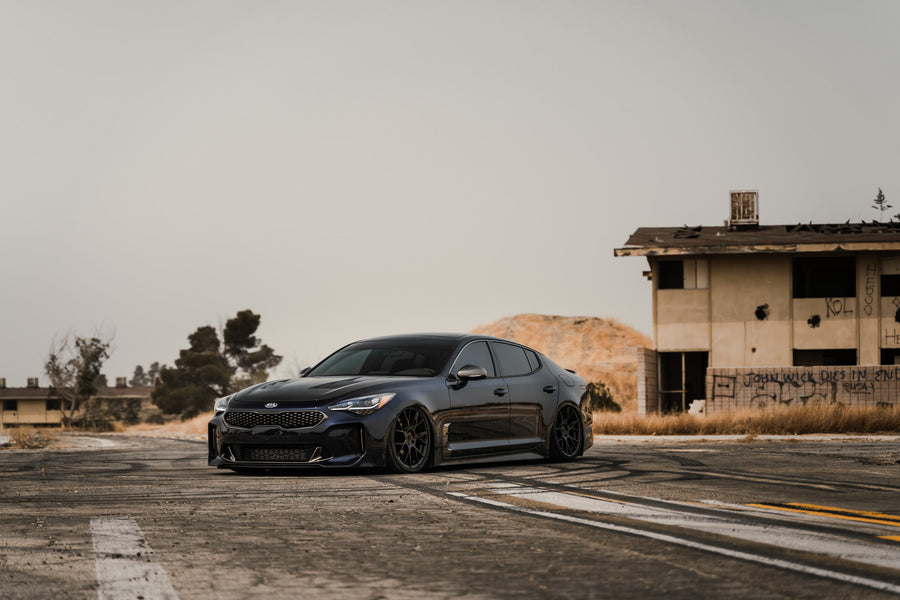 A 2020 Kia Stinger GT AWD on Blaque Diamond BD-F18 Gloss Black Wheels