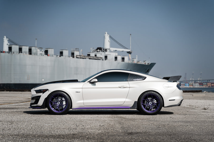 A 2015 Ford Mustang GT on Blaque Diamond BD-F25 Gloss Purple Wheels