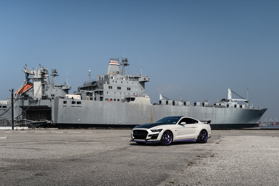A 2015 Ford Mustang GT on Blaque Diamond BD-F25 Gloss Purple Wheels