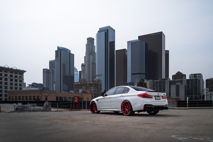 A 2020 BMW M5 Competition on Blaque Diamond BD-F18 Custom Brushed Lollipop Red Wheels