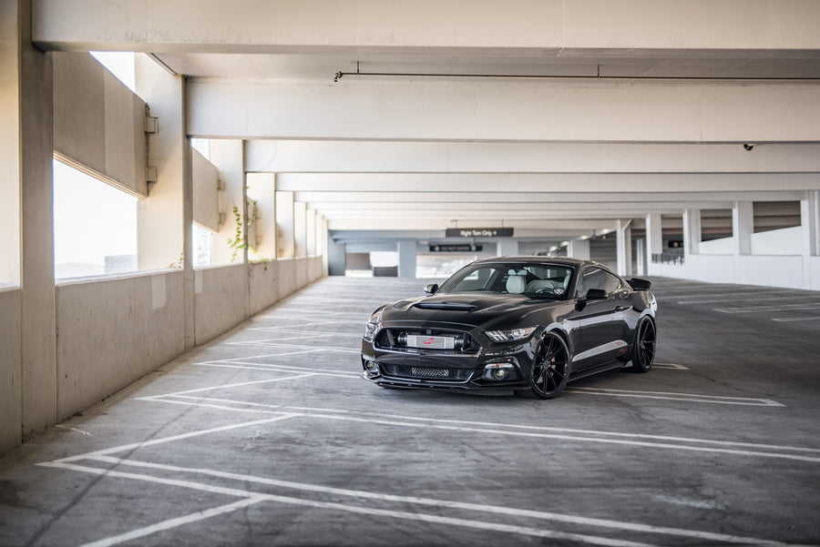 A 2015 Ford Mustang GT Foose Edition on Blaque Diamond BD-11 Gloss Black Staggered Wheels
