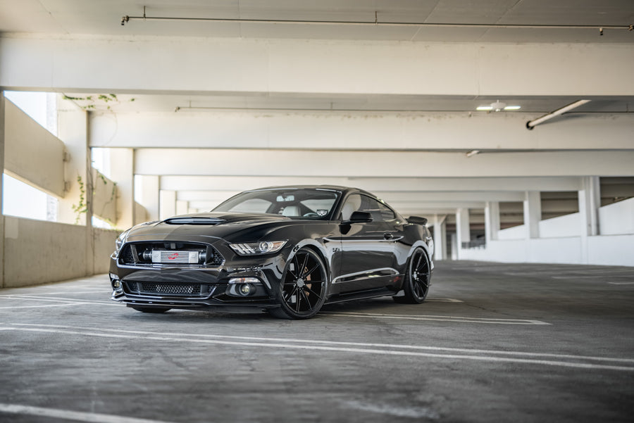 A 2015 Ford Mustang GT Foose Edition on Blaque Diamond BD-11 Gloss Black Staggered Wheels