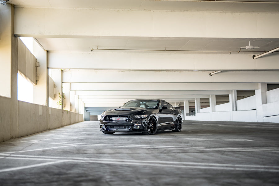 A 2015 Ford Mustang GT Foose Edition on Blaque Diamond BD-11 Gloss Black Staggered Wheels