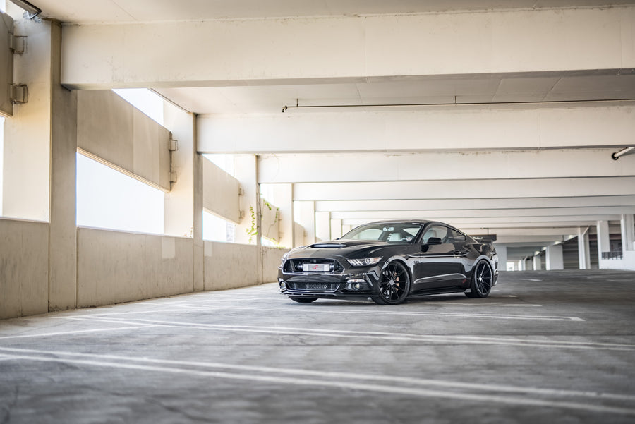 A 2015 Ford Mustang GT Foose Edition on Blaque Diamond BD-11 Gloss Black Staggered Wheels