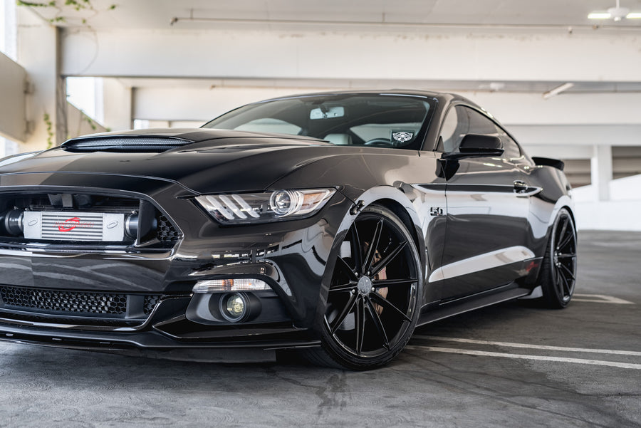 A 2015 Ford Mustang GT Foose Edition on Blaque Diamond BD-11 Gloss Black Staggered Wheels