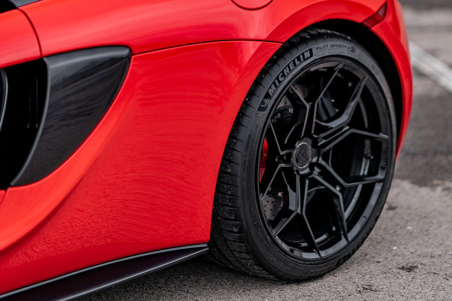 A 2020 McLaren 570s on 20 Inch Blaque Diamond BD-F25 Gloss Black Wheels