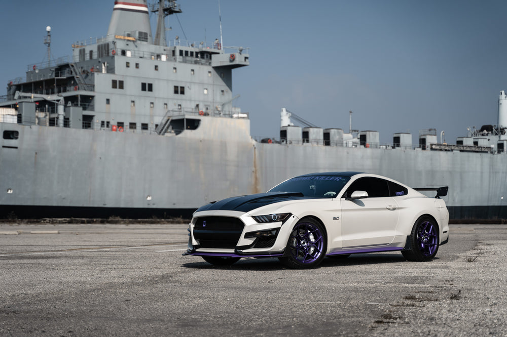 A 2015 Ford Mustang GT on Blaque Diamond BD-F25 Gloss Purple Wheels