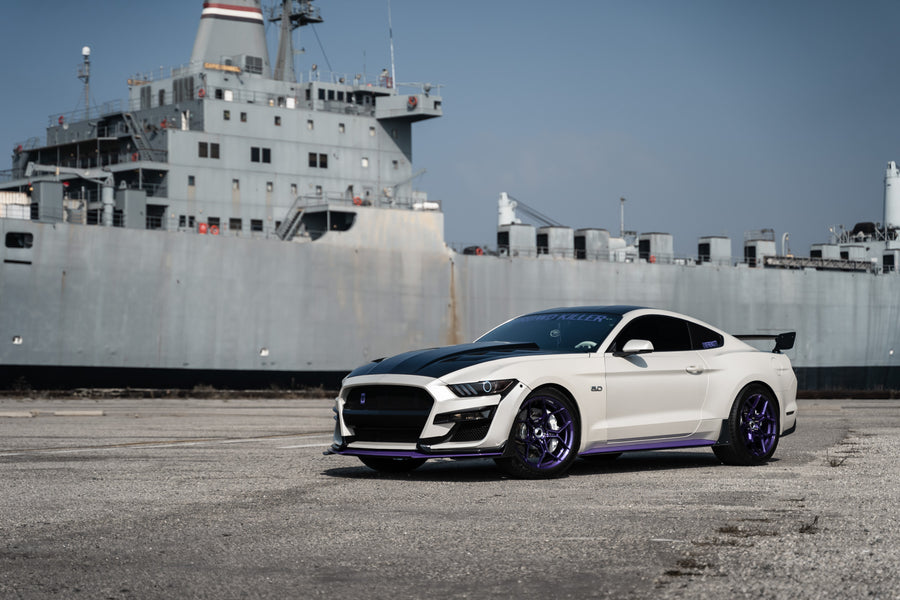 A 2015 Ford Mustang GT on Blaque Diamond BD-F25 Gloss Purple Wheels