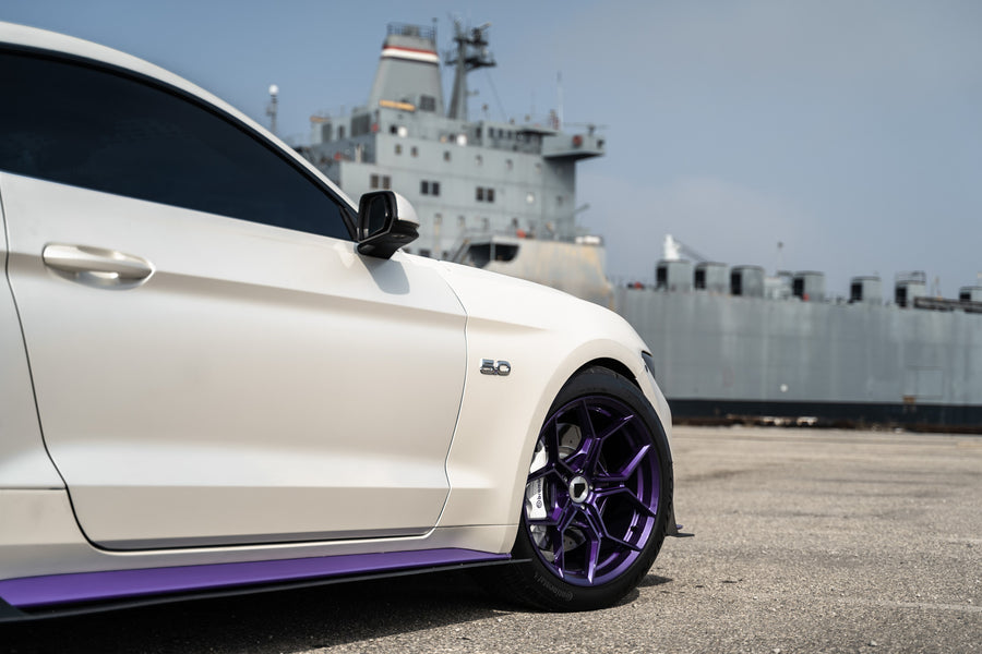 A 2015 Ford Mustang GT on Blaque Diamond BD-F25 Gloss Purple Wheels