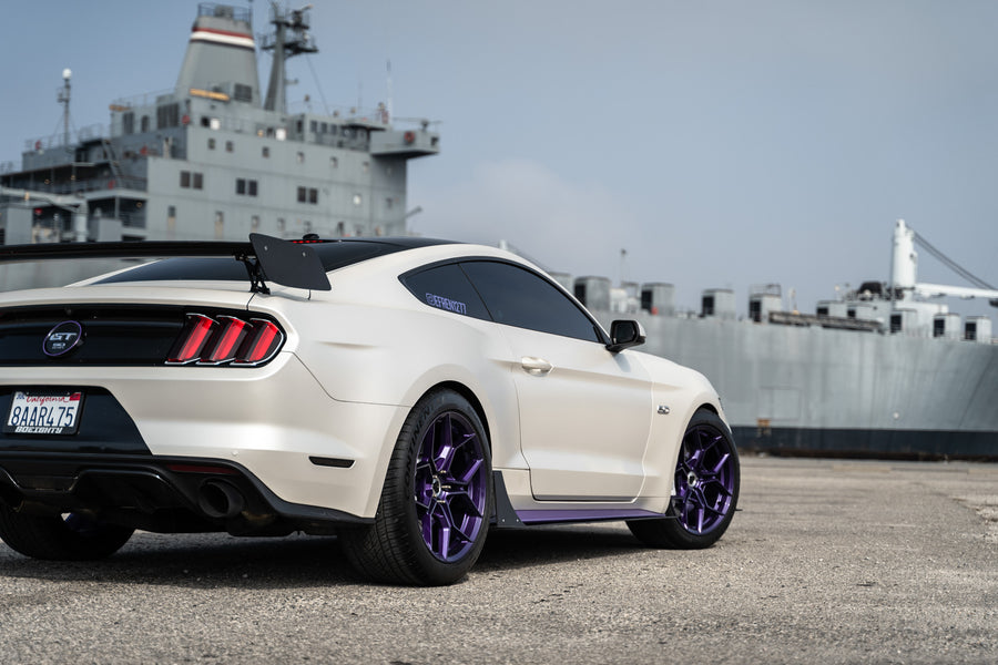 A 2015 Ford Mustang GT on Blaque Diamond BD-F25 Gloss Purple Wheels