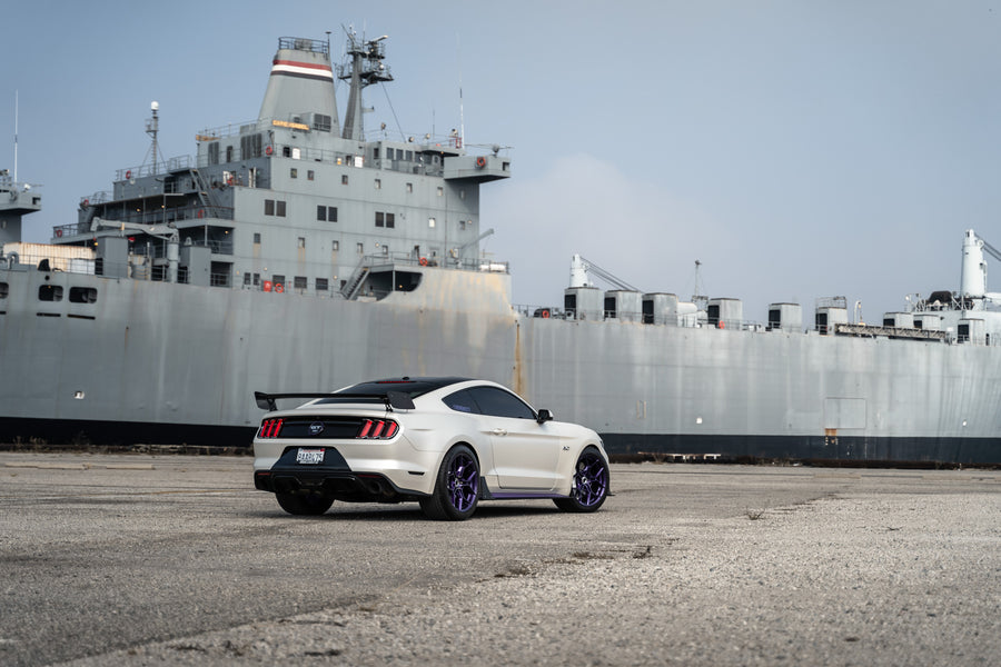 A 2015 Ford Mustang GT on Blaque Diamond BD-F25 Gloss Purple Wheels