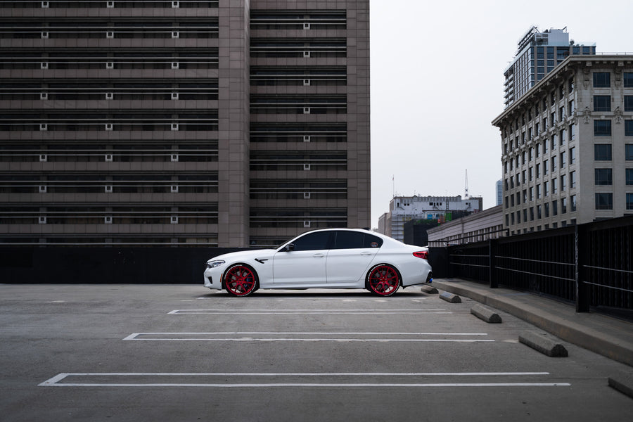 A 2020 BMW M5 Competition on Blaque Diamond BD-F18 Custom Brushed Lollipop Red Wheels
