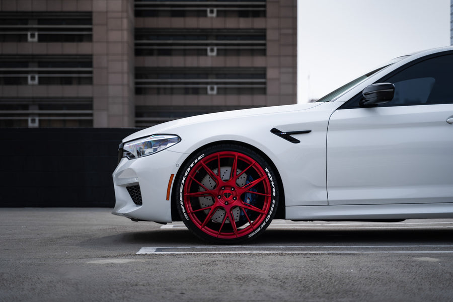 A 2020 BMW M5 Competition on Blaque Diamond BD-F18 Custom Brushed Lollipop Red Wheels