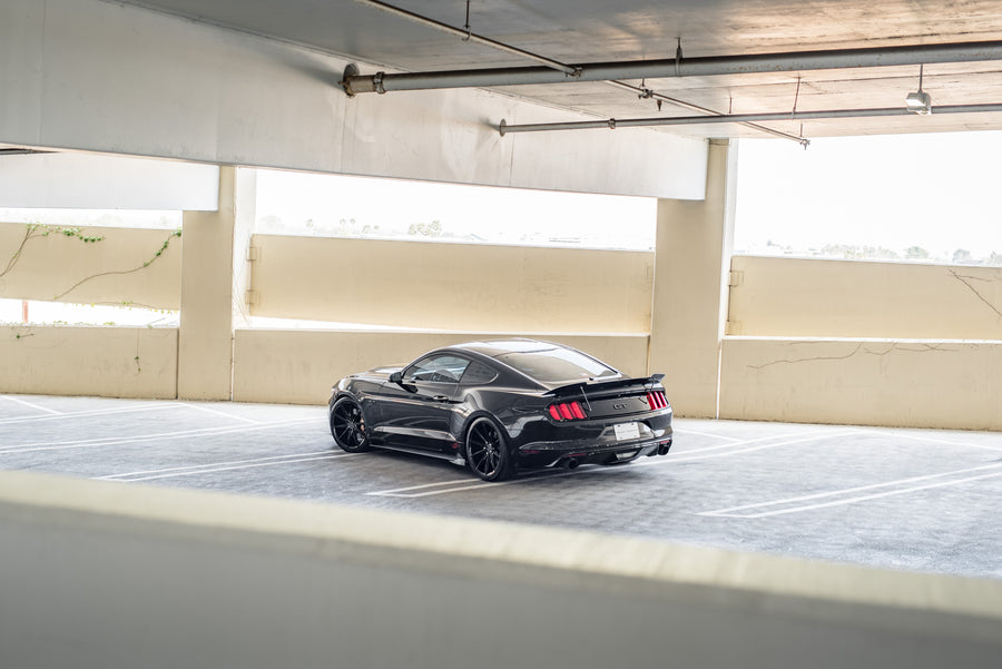 A 2015 Ford Mustang GT Foose Edition on Blaque Diamond BD-11 Gloss Black Staggered Wheels
