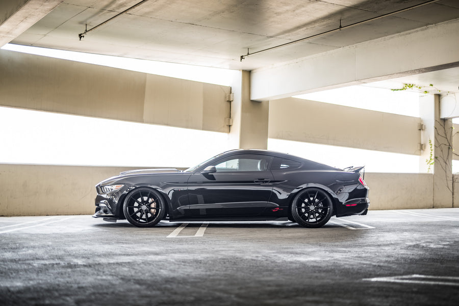 A 2015 Ford Mustang GT Foose Edition on Blaque Diamond BD-11 Gloss Black Staggered Wheels