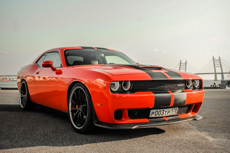 An Orange Dodge Challenger on Blaque Diamond BD-23 Gloss Black Wheel