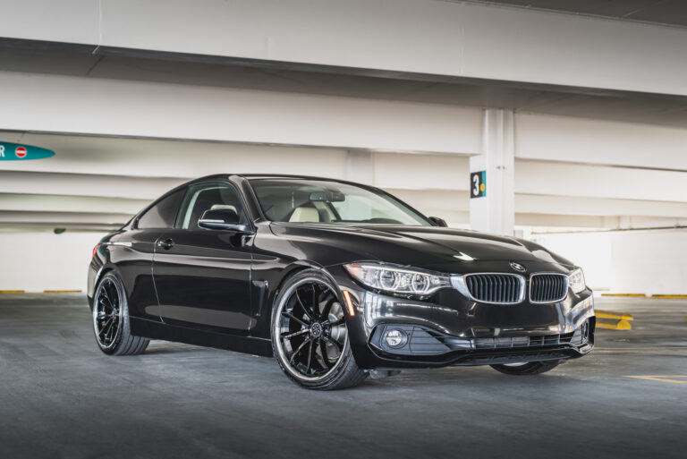 A 2014 BMW 428i on Staggered Blaque Diamond BD-23 Black with Chrome Lip Wheels