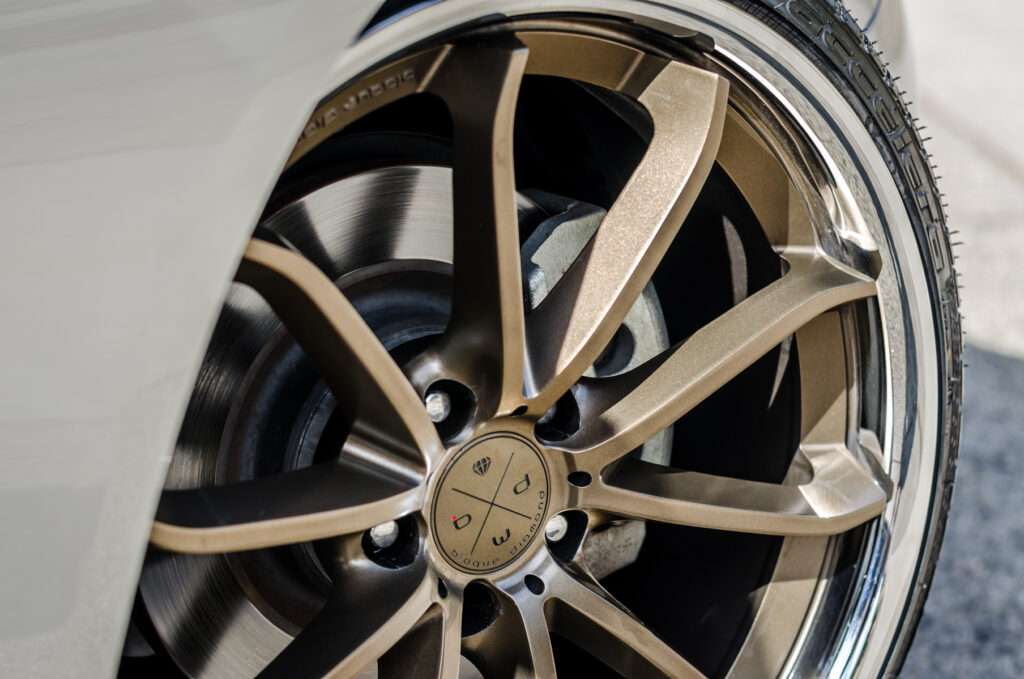 A Silver 2014 Infiniti Q50 on Blaque Diamond BD-23 Bronze Chrome Wheels