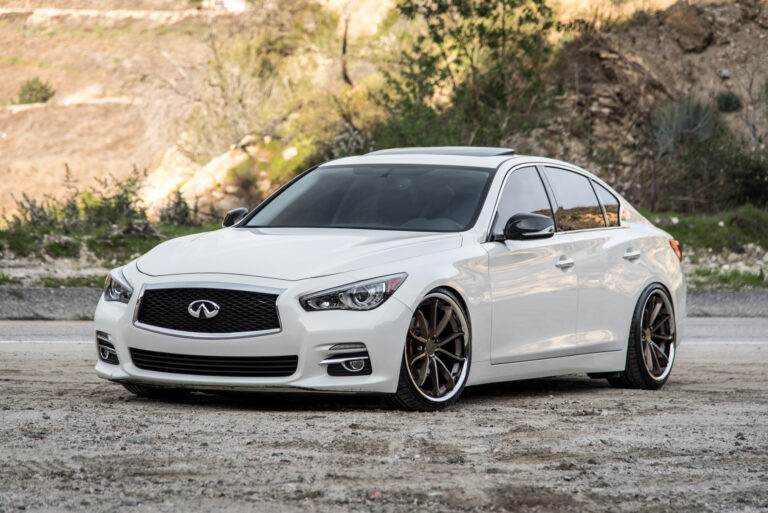 A White 2015 Infiniti Q50 on 20 Inch Blaque Diamond BD-23 Bronze Chrome Wheels