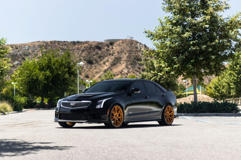 A 2017 Cadillac ATSV on 20 Inch Blaque Diamond BD-F18 Gold Wheels