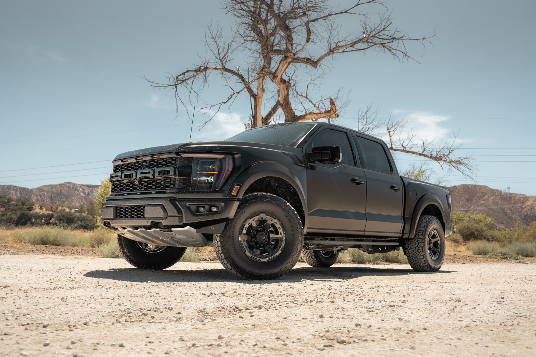 A 2022 Ford Raptor on Blaque Diamond BD-O728 Tinted Machined Black Wheels