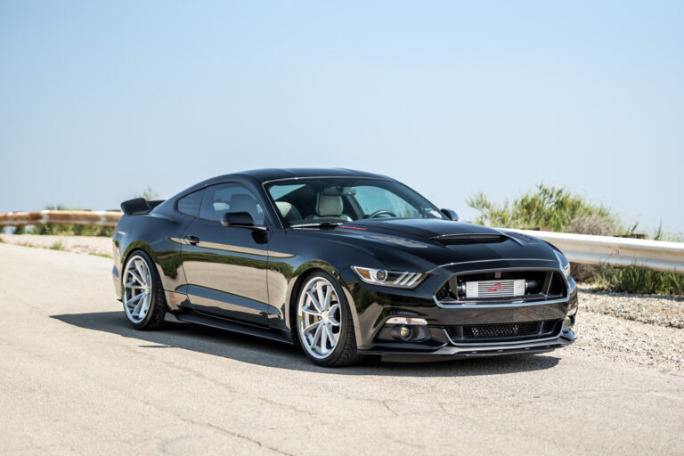 A 2015 Ford Mustang GT Chip Foose Edition on Staggered Blaque Diamond BD-23 Silver with Chrome Lip Wheels