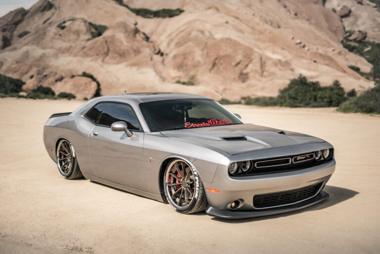 A 2015 Dodge Challenger Scat Pack on Blaque Diamond BD-23 Bronze with Chrome Lip Wheels