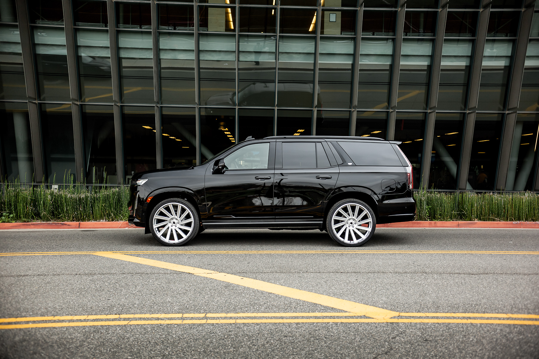 A 2022 Cadillac Escalade on Blaque Diamond BD-40 Brushed Silver Wheel with Floating Cap