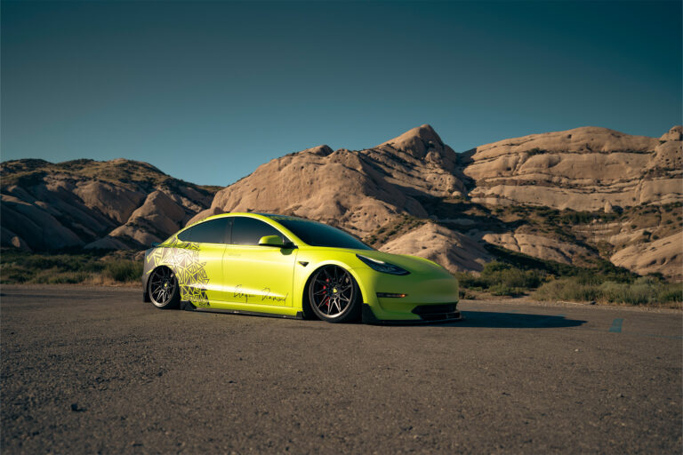 Bagged Tesla Model 3 on Blaque Diamond F20 wheels.